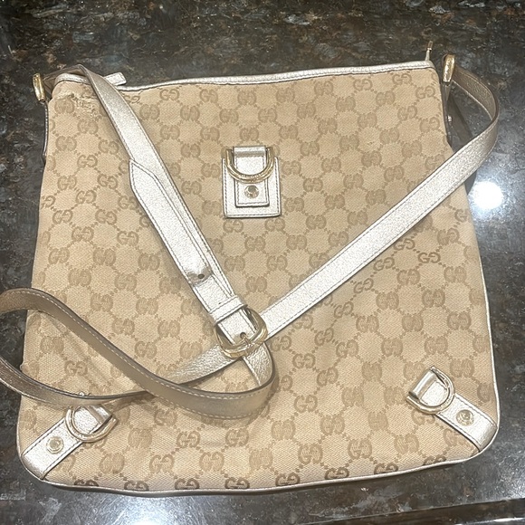Gucci Handbags - Gucci cross body/with metallic trim in champagne gold